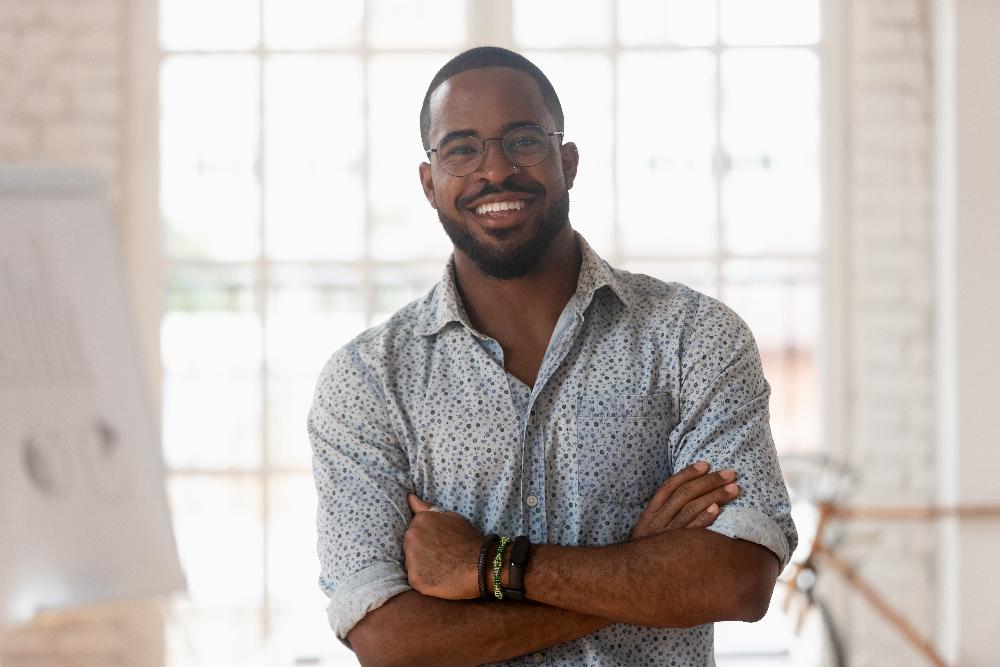 man with glasses smiling | dentist farmington hills mi