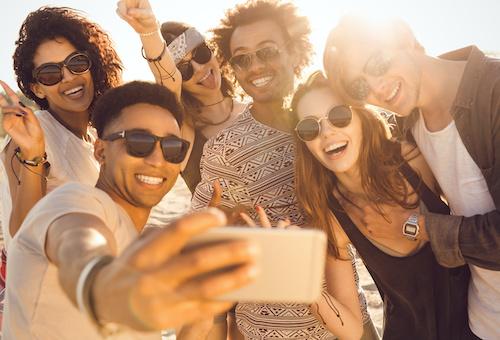 group of young people smiling | cosmetic dentist farmington hills mi