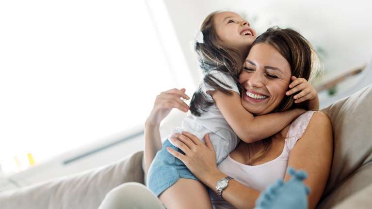 woman with daughter hugging | general dentistry farmington hills mi