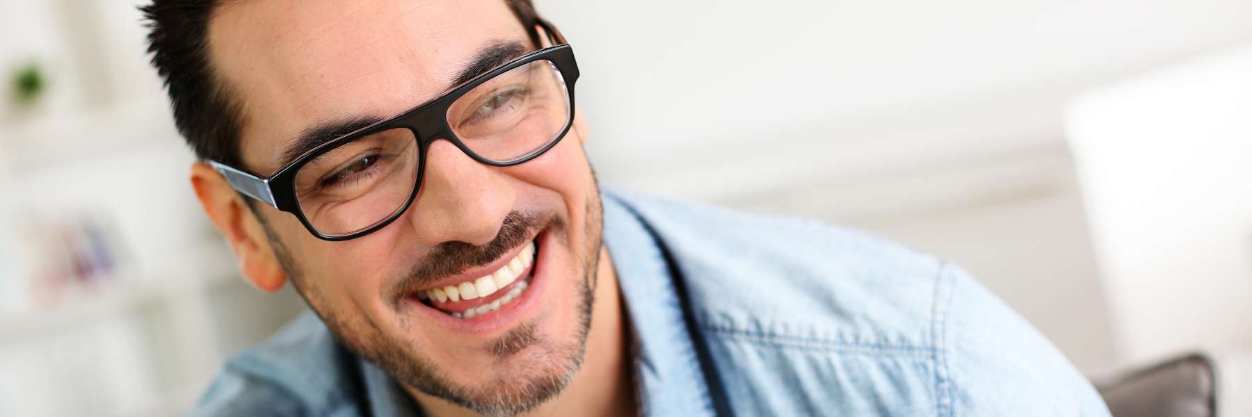 man in glasses smiling | dentist farmington hills